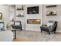 Living room featuring a modern fireplace and comfortable seating at 3203 Monaco Blvd, New Smyrna Beach, FL 32168