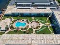 Aerial view showcasing the community pool and surrounding grounds at 325 Causeway # E 203, New Smyrna Beach, FL 32169