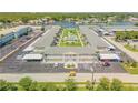 Aerial view of community, highlighting parking and pool at 335 N Causeway # H050, New Smyrna Beach, FL 32169