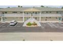 Exterior view of building, showing parking and landscaping at 335 N Causeway # H050, New Smyrna Beach, FL 32169