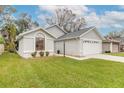 Charming one-story house featuring a spacious yard and attached garage at 3441 Gaveson Ct, Port Orange, FL 32129