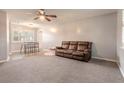 Living room with brown reclining sofa and dining area at 413 Division Ave, Ormond Beach, FL 32174