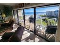 Living room with sliding doors opening to a stunning ocean view at 4501 S Atlantic Ave # 5180, New Smyrna Beach, FL 32169