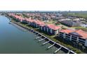 Aerial view of condos with boat slips, lush landscaping and stunning water views at 456 Bouchelle Dr # 202, New Smyrna Beach, FL 32169