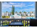 Balcony view of the community pool and surrounding buildings at 4590 S Atlantic Ave # 258A, Ponce Inlet, FL 32127