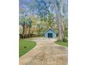 Detached garage with a paved driveway at 472 Wildwood Dr, New Smyrna Beach, FL 32168