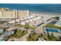 Aerial view showcasing condo building and beach location at 505 N Atlantic Ave # 29, New Smyrna Beach, FL 32169