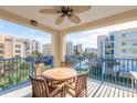 Private balcony with table and chairs, offering scenic views of the surrounding area at 5300 S Atlantic Ave # 15-401, New Smyrna Beach, FL 32169