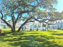 Relaxing courtyard with lush landscaping, pergola, and seating at 541 S Peninsula Ave # A03, New Smyrna Beach, FL 32169