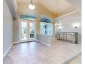 Spacious dining room with tile floors and large windows at 720 Stonewood Ct, New Smyrna Beach, FL 32168