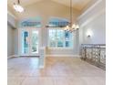 Spacious dining room with tile floors and large windows at 720 Stonewood Ct, New Smyrna Beach, FL 32168