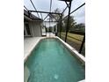 Refreshing screened-in pool perfect for relaxation at 720 Stonewood Ct, New Smyrna Beach, FL 32168