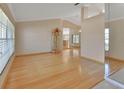 Hardwood floors and large windows in the open living area at 809 E 7Th Ave, New Smyrna Beach, FL 32169