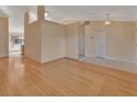 Spacious living room with hardwood floors and neutral tones at 809 E 7Th Ave, New Smyrna Beach, FL 32169