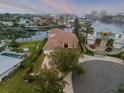 Waterfront home with pool and circular driveway, beautiful sunset views at 107 Via Amalfi, New Smyrna Beach, FL 32169