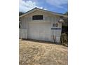 Detached garage with Packard Garage signage at 1132 Australia Ave, Daytona Beach, FL 32114