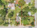 Aerial view of the property highlighting the boundaries, landscaping, and surrounding neighborhood at 115 E Turgot, Edgewater, FL 32132