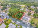 Lot view, surrounded by water and other properties at 122 Azalea Rd, Edgewater, FL 32141