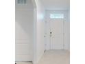 Bright entryway with white door and tile flooring at 126 Old Mill Pond Rd, Edgewater, FL 32141