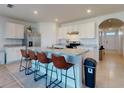 Modern kitchen with island, stainless steel appliances, and white cabinets at 126 Old Mill Pond Rd, Edgewater, FL 32141