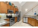 Modern kitchen featuring stainless steel appliances and wood cabinets at 1957 Turnbull Lakes Dr, New Smyrna Beach, FL 32168