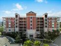 Stunning multi-story condo building with private balconies and lush landscaping offers luxurious living at 2 Riverwalk Dr # 402, New Smyrna Beach, FL 32169