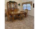 Bright dining room featuring a large table and hutch at 2259 Candlewood E Ln, New Smyrna Beach, FL 32168