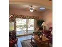 Relaxing living room with sliding glass doors and view at 2259 Candlewood E Ln, New Smyrna Beach, FL 32168