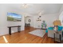 Bright and airy living room with hardwood floors, white walls, and ample natural light from large windows at 229 Columbus Ave, Daytona Beach, FL 32118