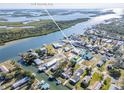 Bird's-eye view showcasing home's waterfront location and neighborhood at 275 Randle Ave, Oak Hill, FL 32759