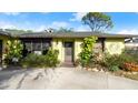 Inviting entrance with lush landscaping enhancing the curb appeal of this well-maintained property at 2813 Sabal Palm Dr, Edgewater, FL 32141