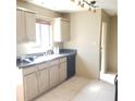 Well-lit kitchen featuring a stainless steel sink, granite countertops, and matching appliances at 322 Canal Rd # 16, Edgewater, FL 32132