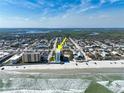 Aerial view of beachfront condo with pool, close to local community and gorgeous sandy beach at 3405 S Atlantic Ave # 501, New Smyrna Beach, FL 32169