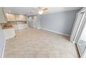 Bright living room with tile floors and kitchen access at 3641 S Atlantic Ave # 221, Daytona Beach, FL 32118