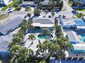 An aerial view showcasing a home with a pool and tropical landscaping at 402 Lincoln Ave, New Smyrna Beach, FL 32169