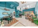 Spacious living room with high ceilings, fireplace and piano at 50 Pompano Dr, Ponce Inlet, FL 32127