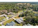 An aerial view showcasing a single story home's location in a residential neighborhood at 51 Club House Blvd, New Smyrna Beach, FL 32168