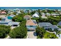 Aerial view of a neighborhood near the ocean, featuring beach access at 6345 River Rd, New Smyrna Beach, FL 32169