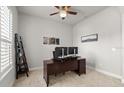 Home office features a large desk, ample space, and neutral decor at 6807 Ragatz Ln, Port Orange, FL 32128