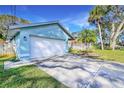 White garage door and concrete driveway at 806 E 21St Ave, New Smyrna Beach, FL 32169