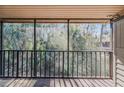View from the screened patio showcasing the lush green scenery and privacy at 150 Wax Myrtle Woods Ct # 7B, Deltona, FL 32725