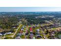 Aerial view showcasing a home's location in a quiet neighborhood near a beautiful body of water at 234 Meadow Lake Dr, Edgewater, FL 32141