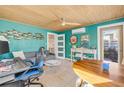 Stylish home office with a colorful design, a large desk, and plenty of space for work or hobbies at 308 Normandy Ave, New Smyrna Beach, FL 32169