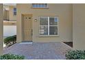 Inviting front entrance with a charming brick walkway and a well-maintained facade at 3546 Casalta Cir, New Smyrna Beach, FL 32168