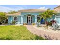Charming home featuring a beautiful walkway and lush landscaping at 3728 Egret Dunes Dr, Ormond Beach, FL 32176