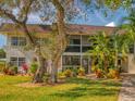 Charming multi-story condo featuring well-maintained landscaping and a cozy balcony at 3800 Saxon Dr # 250, New Smyrna Beach, FL 32169
