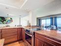Beautiful kitchen featuring granite countertops, stainless steel appliances, and modern finishes at 4445 S Atlantic Ave # 804, Ponce Inlet, FL 32127
