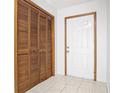 Bright entryway with a closet and tiled flooring at 448 Shorewood Ln, New Smyrna Beach, FL 32168