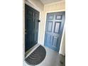 Condo entrance featuring unit numbers and secure entry doors, ensuring privacy and security at 4860 S Atlantic Ave # 1030, New Smyrna Beach, FL 32169