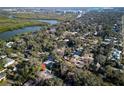 Aerial view of a residential area showcasing the property's surroundings, river, and Canal Street at 820 Faulkner St, New Smyrna Beach, FL 32168